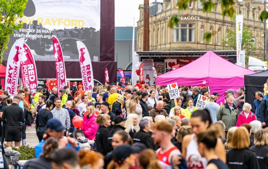 Crowds at Sunderland City Runs. Banners reading Red Sky Foundation in the background.
